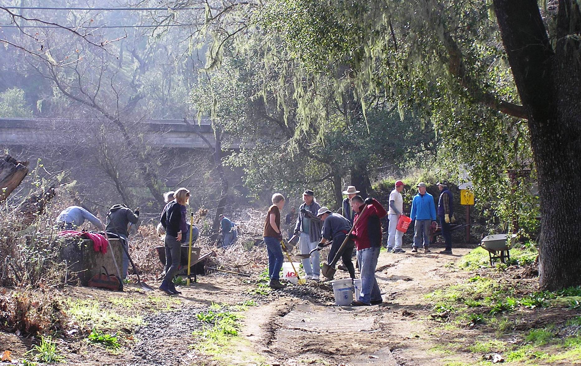 Cleaning up the pathway to the kiosk . . . all the DG was washed away!